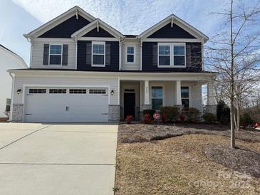 Charming two-story home with a two-car garage, landscaped yard, and covered front porch at 228 Heatherland Dr, Rock Hill, SC 29732