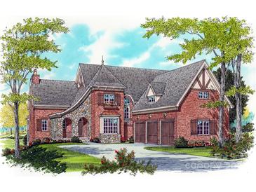 Charming home featuring a brick and stone facade, arched entryway, and three-car garage at 405 Creeping Cedar Ct, Waxhaw, NC 28173