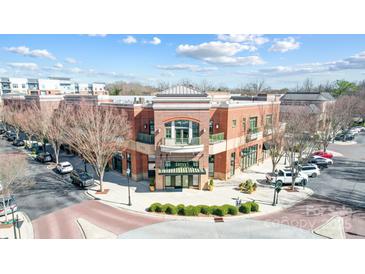 A stately brick exterior building with architectural details and well maintained landscaping, ideal for commercial or residential at 720 Governor Morrison St # 207, Charlotte, NC 28211