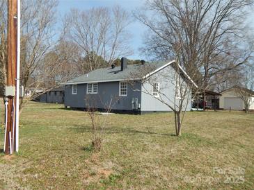 Charming single-story home featuring a well-maintained lawn and traditional architectural details at 915 Chapel St, Landis, NC 28088