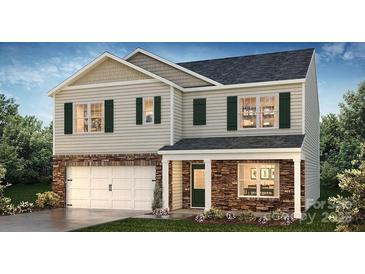 Charming two-story home featuring stone accents and a welcoming front porch at 119 Meadow View Dr, Statesville, NC 28677