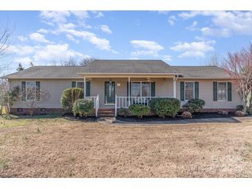Charming single-story home features a covered front porch and manicured landscaping at 706 Skinner Rd, Shelby, NC 28152