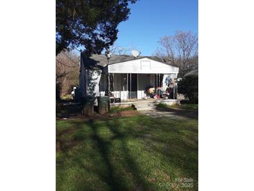 A single-story home with a small porch and cluttered exterior at 1162 Cedar Grove Ln, Rock Hill, SC 29732