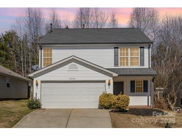 Charming two-story home with a well-maintained lawn, a two-car garage, and beautiful curb appeal at 3230 Richway Ct, Charlotte, NC 28216
