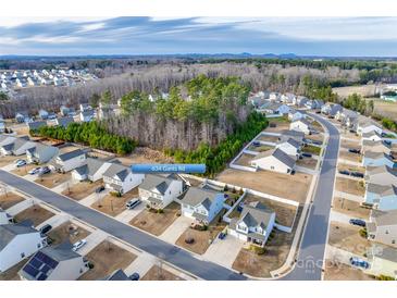 Aerial view of the home, situated in a neighborhood surrounded by trees and nature at 634 Gants Rd, York, SC 29745