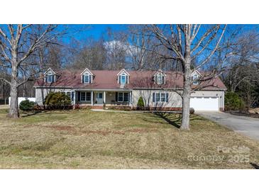 Charming single-Gathering home featuring a long, covered front porch and an attached two-car garage at 468 White Oak Branch Rd, Statesville, NC 28625