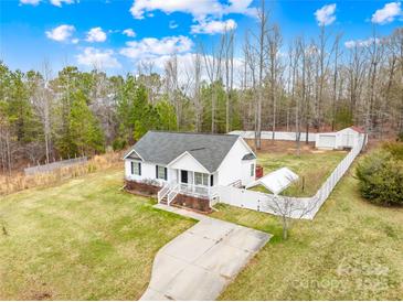 Aerial view of a well-maintained home featuring a spacious yard, driveway, and private backyard at 348 Fleetwood Rd, York, SC 29745