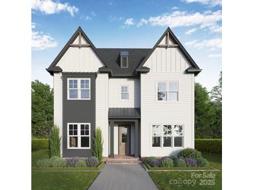 Charming two-story home with a mix of modern gray and white, complemented by well-manicured landscaping at 19032 Newburg Hill Rd, Davidson, NC 28036