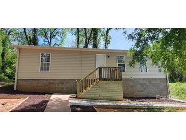 Charming single-story home featuring a new wooden staircase leading to the front entrance and a well-maintained yard at 351 Haigler St, Rock Hill, SC 29732