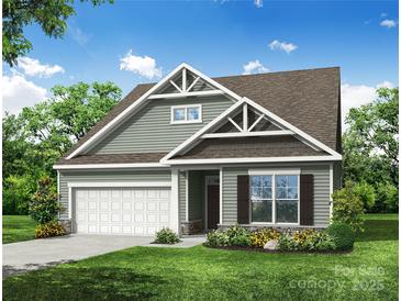 Charming single-Gathering home with green siding, a two-car garage, and well-maintained landscaping at 153 Prestwick Way # 37, Mooresville, NC 28115