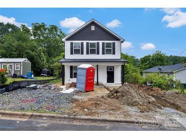 Charming two-story home with black and white exterior paint, black window shutters, and landscaping to be finished at 425 Messner St, Salisbury, NC 28144