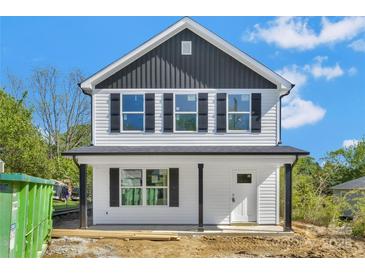 Charming new two-story home with white siding, black shutters, and a covered front porch at 425 Messner St, Salisbury, NC 28144