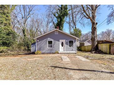 Charming one-story home with gray siding, white trim, and a welcoming front door at 4924 Jane Ave, Charlotte, NC 28269