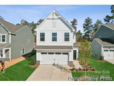 Charming two-story home features a modern facade, well-manicured lawn, and attached garage at 116 Shay Crossing Rd # 2P, Salisbury, NC 28144