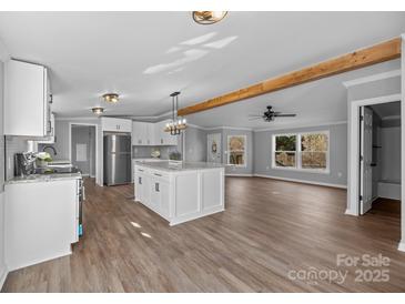 Modern kitchen with granite counters, large island, stainless steel appliances and lots of natural light at 1254 Raxter Rd, Edgemoor, SC 29712