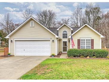 Charming home with a well-maintained lawn and attached two-car garage at 2405 Ivy Run Dr, Indian Trail, NC 28079