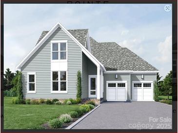 Charming two-story home featuring a symmetrical design, a two-car garage, and verdant landscaping at 4513 Morning Mist Dr # 207, Sherrills Ford, NC 28673