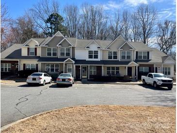 Attractive townhouse complex featuring a well-maintained facade and ample parking at 140 Marakery Rd # C, Mooresville, NC 28115