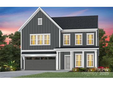 Charming two-story home with gray siding, white trim, covered porch, and an attached garage at 2150 Millennium Dr # 094, Lancaster, SC 29720