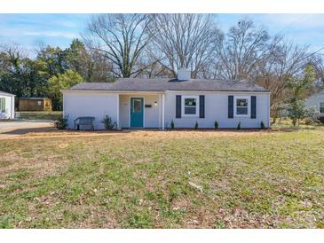 Charming single-story home featuring a bright teal front door and classic vinyl siding at 910 Mcdow Dr, Rock Hill, SC 29732