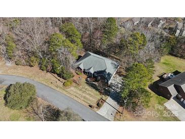 Aerial view of house surrounded by mature trees and long driveway at 10620 S Ford Rd, Charlotte, NC 28214