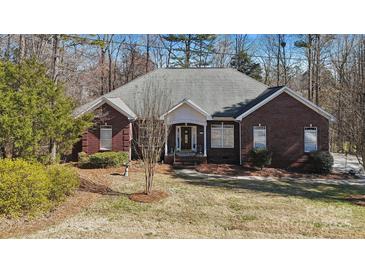 Charming brick home with well-maintained landscaping and a welcoming front entrance at 10620 S Ford Rd, Charlotte, NC 28214