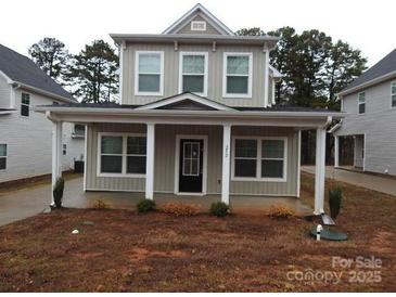 Charming home featuring a welcoming front porch and large windows at 252 Mills Ave, Troutman, NC 28166