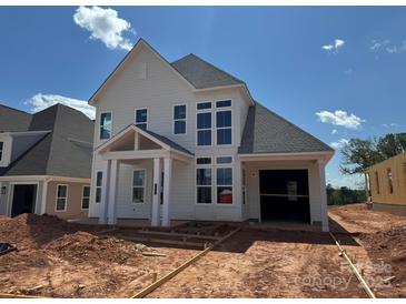 New construction, showcasing the home's white exterior, modern windows, and attached garage at 7441 Fighting Creek Rd # 30, Sherrills Ford, NC 28673