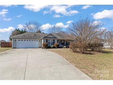 Charming single-story home featuring an attached two-car garage and landscaped front yard with mature trees at 3757 Fieldhaven Ct, Maiden, NC 28650