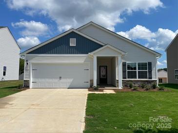Charming single-story home with a two-car garage, covered entrance, and manicured lawn at 3527 Clover Valley Dr, Gastonia, NC 28052