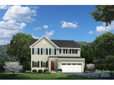 Charming two-story home with a well-manicured lawn, a red front door and an attached two car garage at 497 Kenyon Dr, Denver, NC 28037