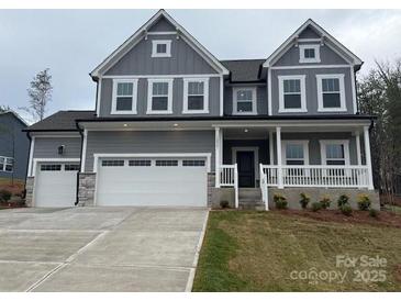 Charming two-story home featuring a classic design and well-manicured landscaping at 12027 Mariners Cove Ct # 381, Lancaster, SC 29720