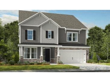 Charming two-story home featuring stone accents, gray siding and a two-car garage at 177 Glenn Dr, Mooresville, NC 28115