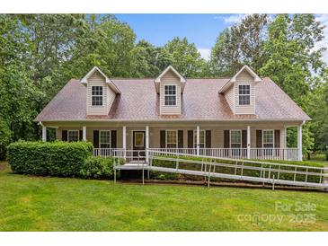 Inviting one-story home with charming front porch,dormers,ramp access, and well-manicured lawn at 3039 Paraham S Rd, York, SC 29745