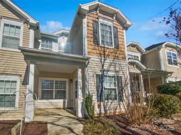 Charming townhouse featuring a covered front porch and craftsman-style details at 10462 Trolley Run Dr, Cornelius, NC 28031