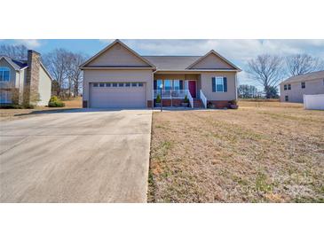 Charming single-Gathering home with a two-car garage and well-maintained front lawn at 1529 Alex Dr, Shelby, NC 28152