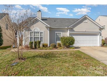 Charming home featuring an attached two-car garage, tidy landscaping, and light siding at 10722 Mountain Springs Dr, Charlotte, NC 28278