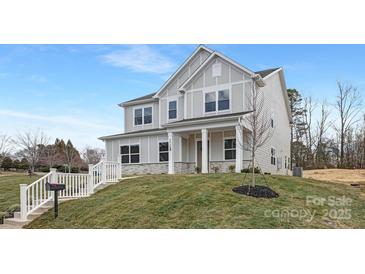 Charming two-story home with a well-manicured lawn and inviting entrance at 3924 13Th Ne St, Hickory, NC 28601