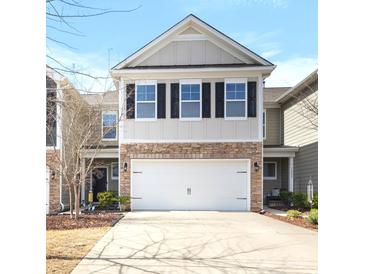 Charming two-story home with stone accents and a spacious two-car garage and a well-kept lawn at 1210 Croft Dr # 96, Fort Mill, SC 29708