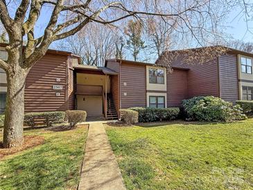 Inviting two-story condo with charming exterior details and lush landscaping, offering a warm and welcoming appeal at 2507 Kilborne Dr # H, Charlotte, NC 28205