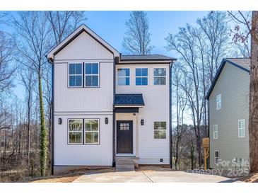 Two-story modern farmhouse with white siding, black trim, and a welcoming front entrance at 527 Crowell Ave, Statesville, NC 28677