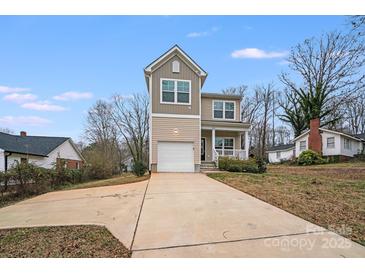 Charming two-story home featuring a one-car garage and a welcoming front porch at 834 N Flint St, Lincolnton, NC 28092