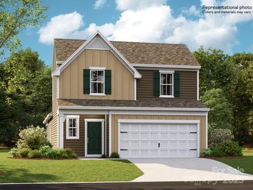Charming two-story home with a two-car garage, shuttered windows, and a well-maintained lawn at 8421 Norman Forest Rd, Lancaster, SC 29720