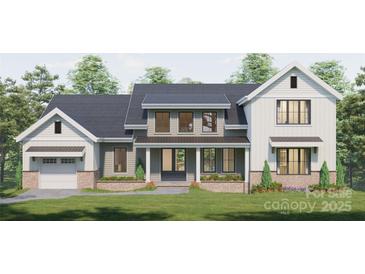 Charming two-story home with grey siding, crisp white trim and inviting covered front porch at 000A Duck Cove Rd, Belmont, NC 28012