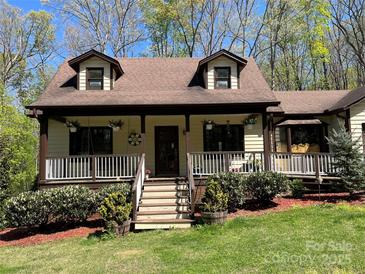 Charming two-story home featuring a welcoming front porch and dormer windows at 1496 Givens St, Hickory, NC 28602