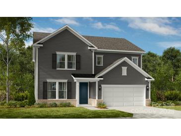 Charming two-story home with gray siding, black shutters, and a manicured front lawn at 5013 Duval Cir, Tega Cay, SC 29708
