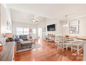 Comfortable living room with vaulted ceiling, hardwood floors, and lots of natural light at 8513 Loxton Cir, Charlotte, NC 28214