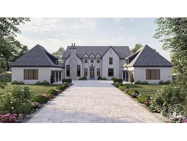 Stunning exterior view of a two-story home with a stone driveway and manicured landscaping at 1025 Maxwell Ct # 7, Marvin, NC 28173