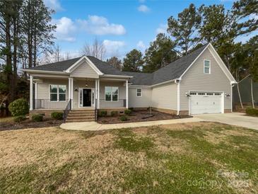 Charming one-story home with a gray exterior, a well-kept lawn, and a two-car garage at 1210 Aragon Beach Rd, Rock Hill, SC 29732