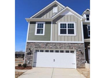 Charming home with a two-car garage and stone accents on the lower level at 4005 Lawnview Dr, Charlotte, NC 28269
